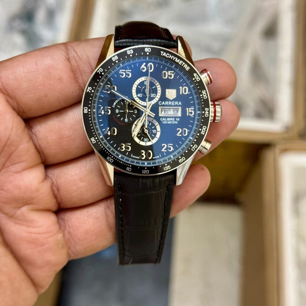 ⭐️ *The sleek, heritage-style design of the TAG Heuer Carrera Calibre 16 Day-Date hearkens back to the collection’s earliest racing roots. The uncluttered, all-black dial is legible in even the most challenging conditions.* ⭐️ - Image 2